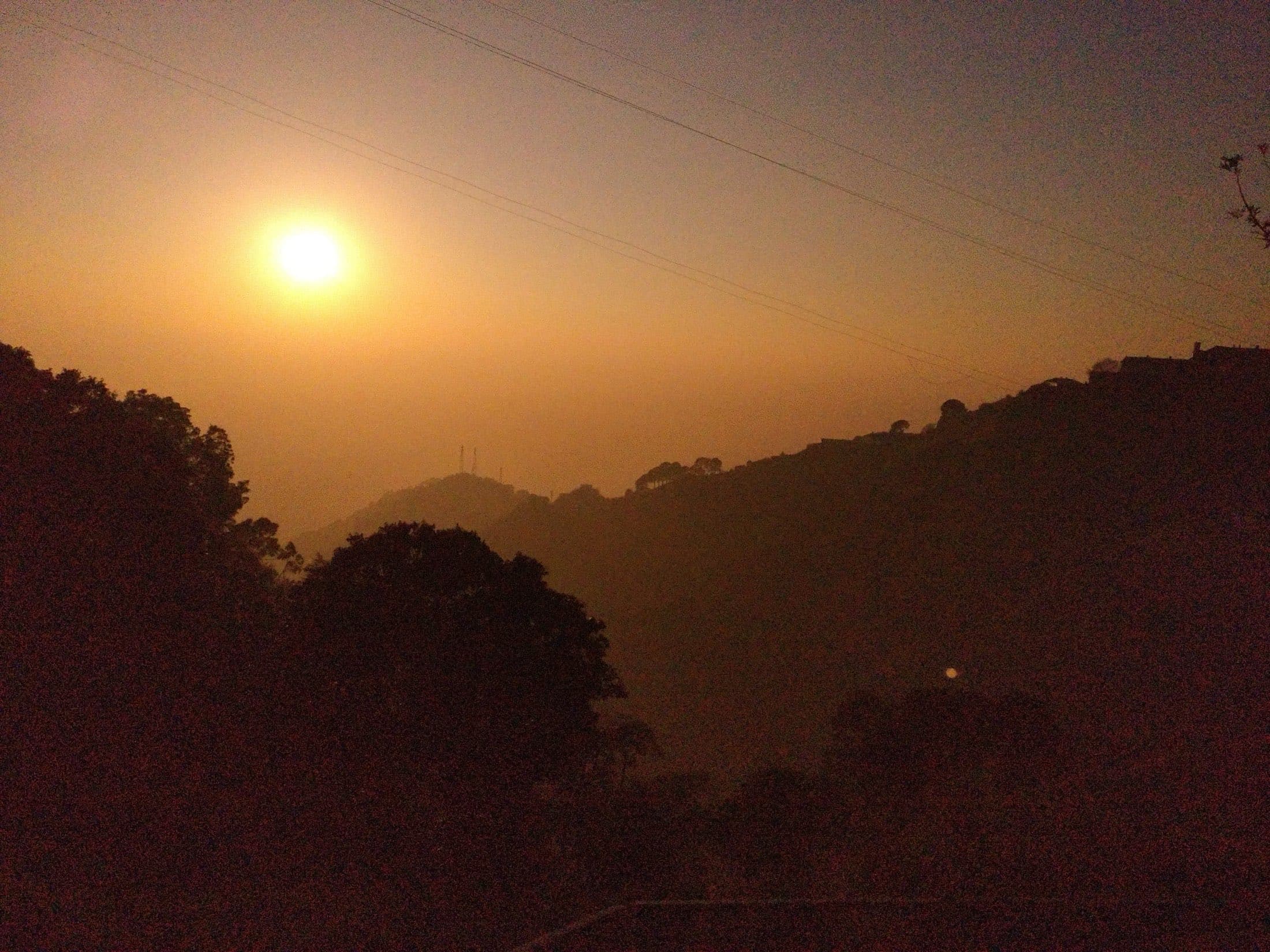 Sunset over the Himalayan foothills near the temple viewpoint